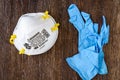BELLEVUE, WA/USA Ã¢â¬â APRIL 18, 2020: PPE safety supplies on a wood table, 3M 8210Plus N95 masks and disposable nitrile gloves Royalty Free Stock Photo